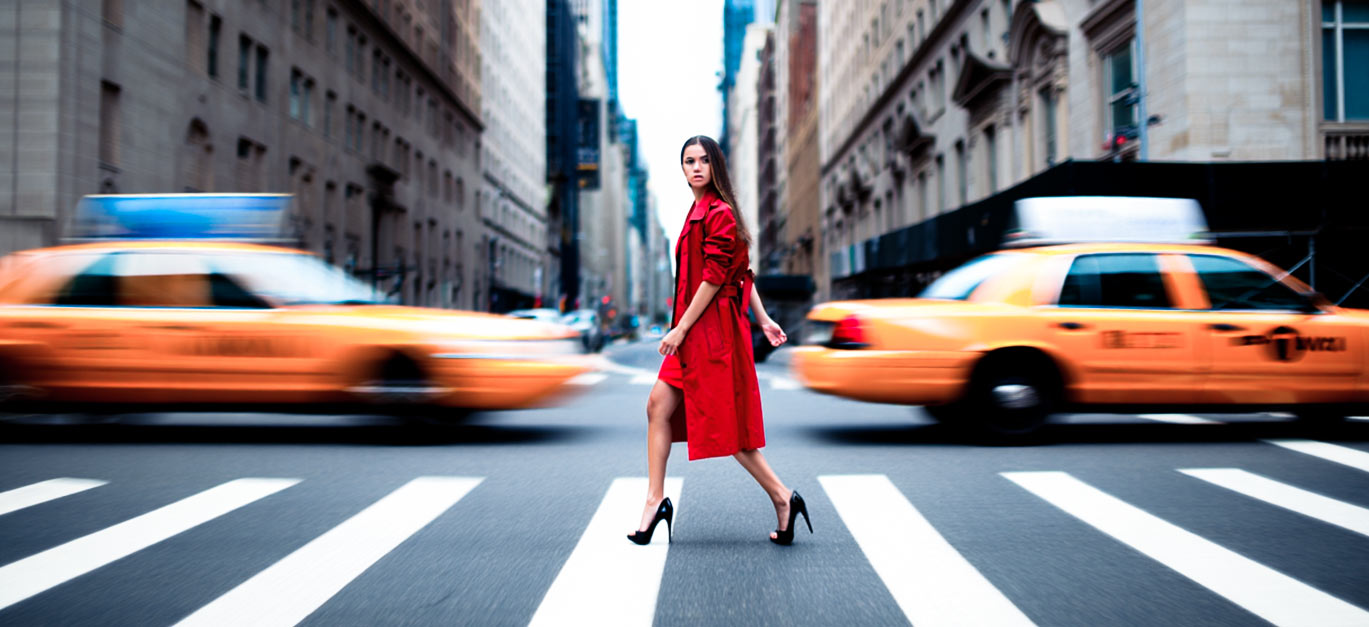 Street photography presets for Lightroom a hero image showing a woman in a red coat crossing the street
