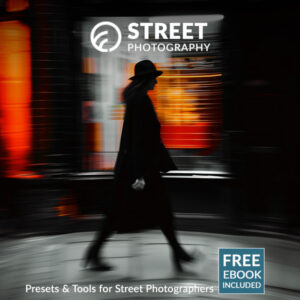 Street Photography Presets cover image showing a candid photo of a woman passing by on the sidewalk, shop lights in the background