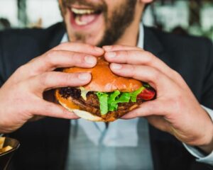 burger idea - man eating burger juicy burger