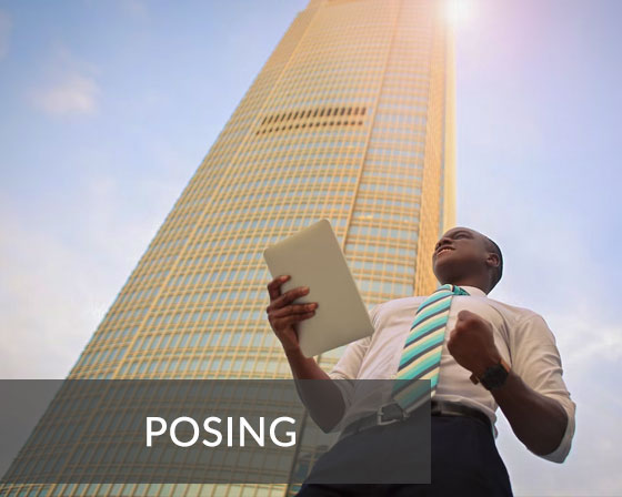 man standing in front of skyscraper, directing and posing the subject effectively