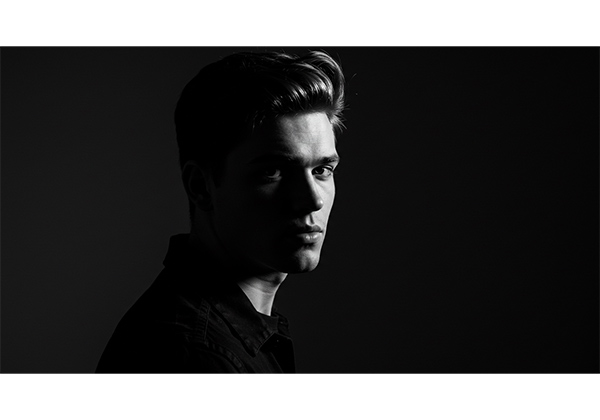 Fine art portrait photography example with dramatic black and white lighting and artistic composition for gallery display