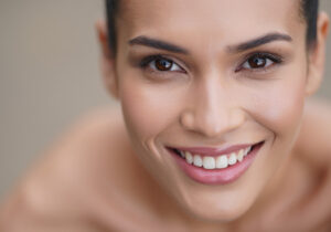 Whiten Teeth in Lightroom - woman smiling directly at the camera, showing her teeth