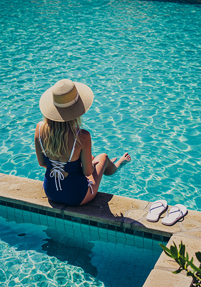 with preset - woman sitting by the pool