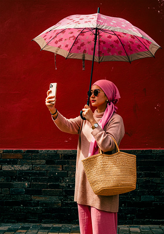 with preset - young woman holding umbrella taking selfie