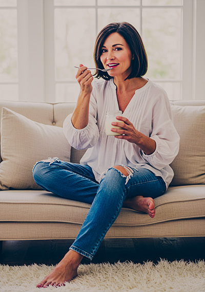 with preset - woman in casual wear sitting on the sofa