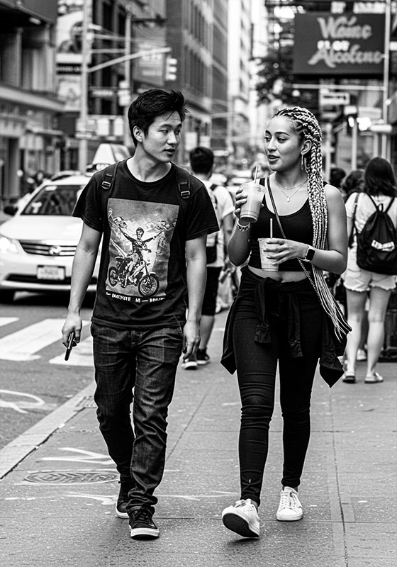 with preset - a young couple walking down the street