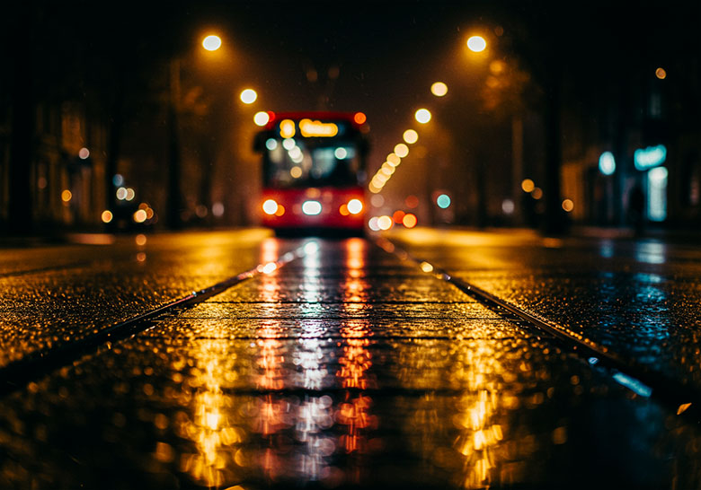 with preset - a wet street at night light from a tram