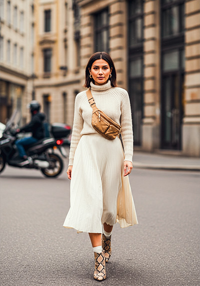 preset example - a stylish woman walking confidently down a city street