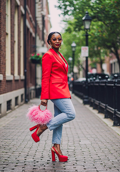 with preset - stylish woman standing on a city sidewalk