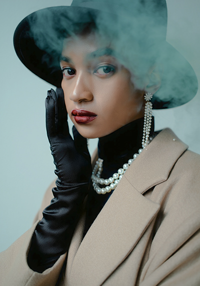 before - fashion photo of a glamorous model with a mysterious and alluring facial expression