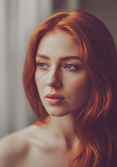 with preset - moody matte portrait of a red hair young woman