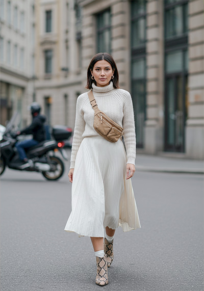 before - a stylish woman walking confidently down a city street