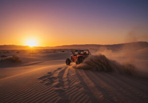 Your Quick Guide to Lightroom Color Grading - a photo of a action scene with a dune buggy, driving at the Baja